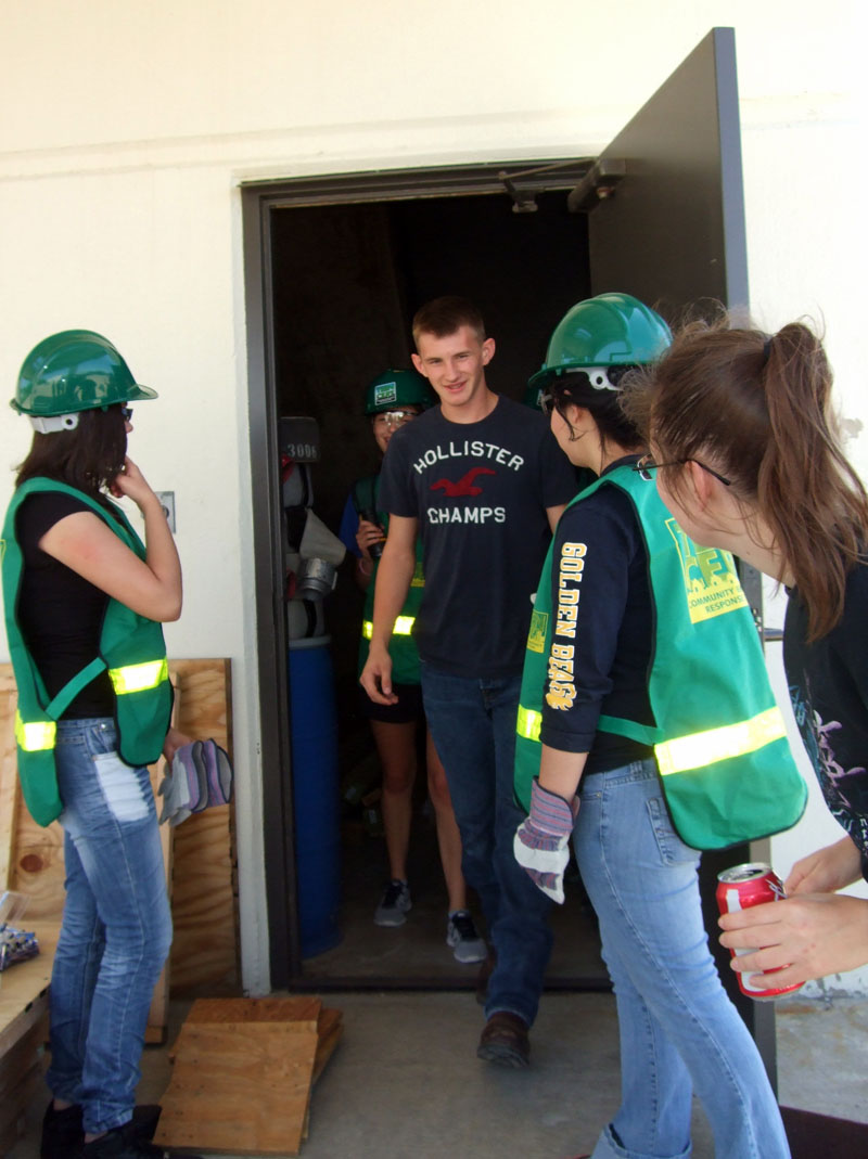 Photo of teens performing training duties